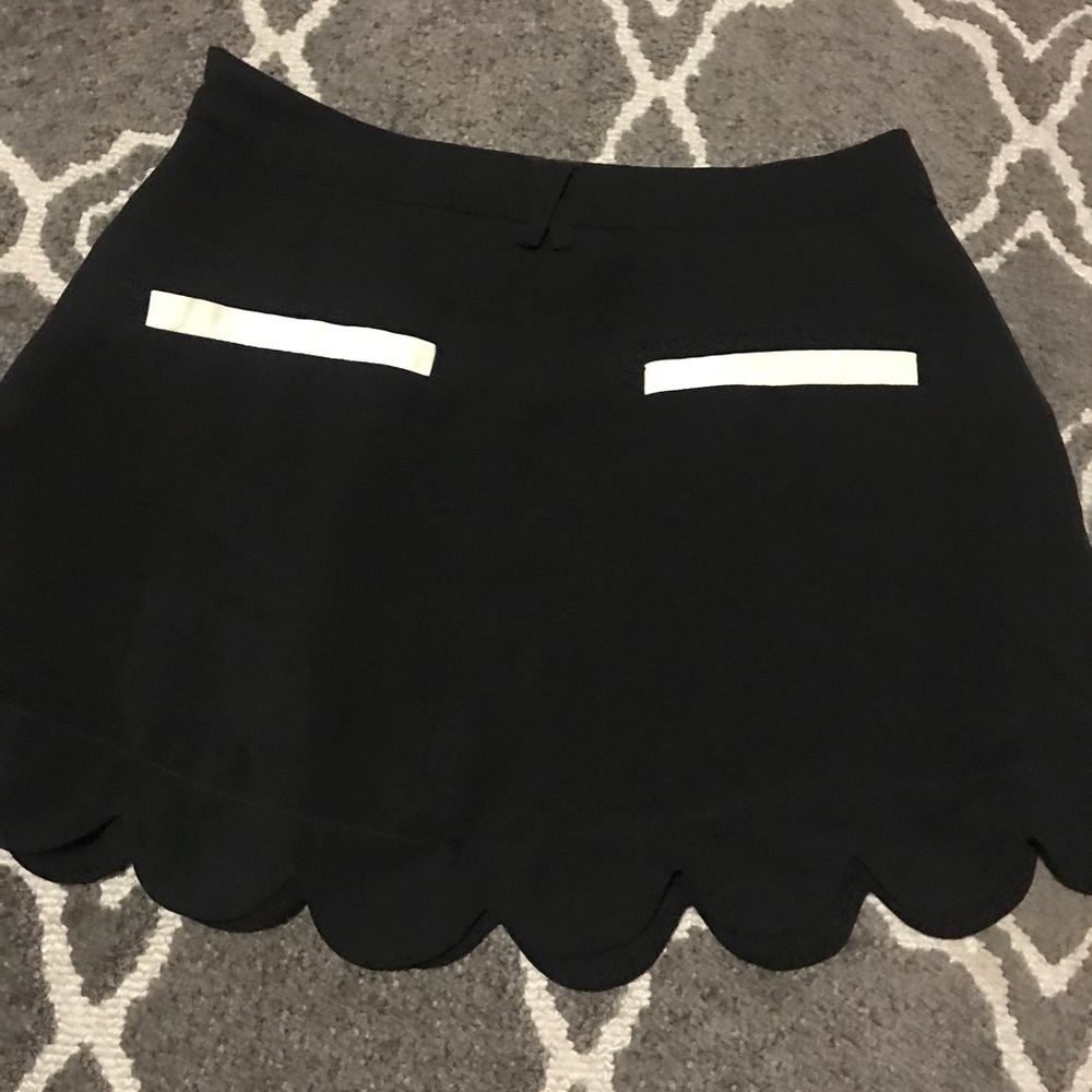 black skirt with leather pockets